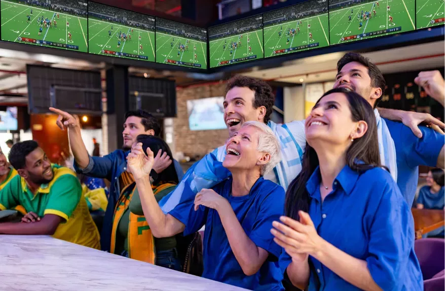 People in a bar watching sports