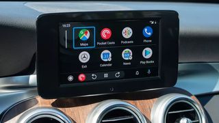 Android Auto home screen with app grid.