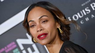 Zoe Saldana is pictured wearing raspberry-red lipstick at The French American Film Festival Opening Night Premiere of Netflix's "Emilia Perez" at DGA Theater Complex on October 29, 2024 in Los Angeles, California.