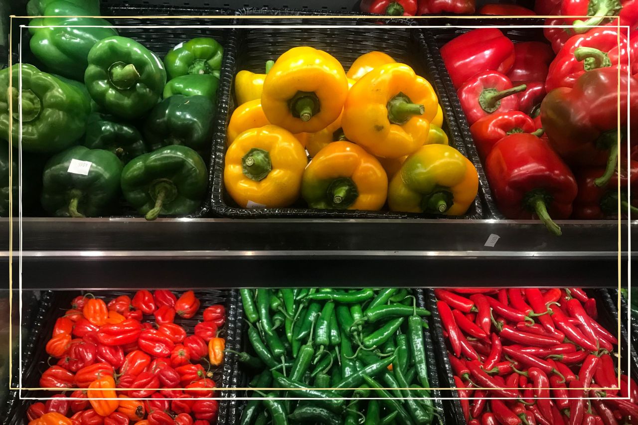 a supermarket shelf showing different varieties of peppers - red, yellow and green bell peppers