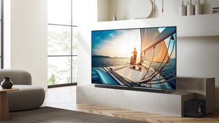 The Samsung QN90C Neo QLED TV in a living room.