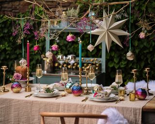 outdoor christmas table setting with purple, gold and blue decor - Wayfair