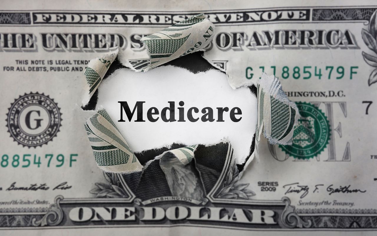 Medicare news headline, inside of torn dollar bill