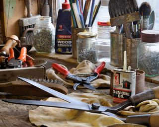 cleaning garden tools in a shed