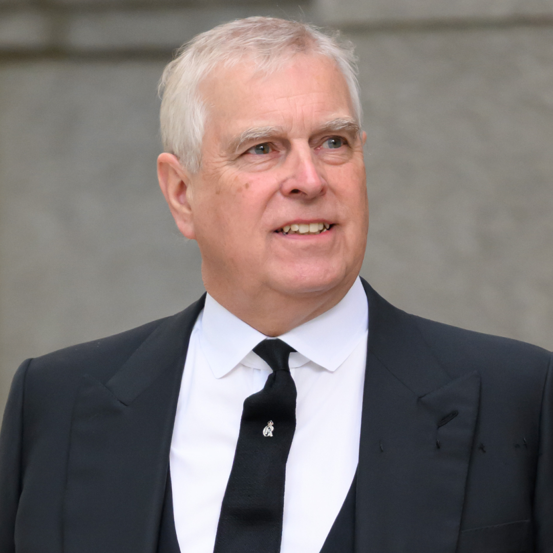 Ex-Prince Andrew wears a black suit with a white shirt and has gray hair