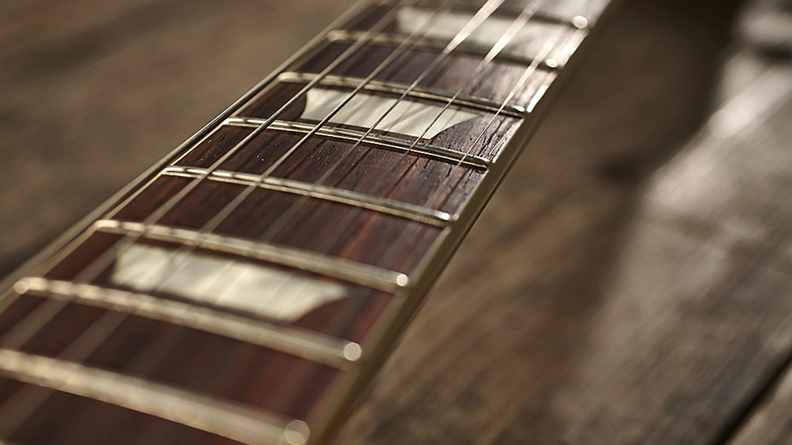 The fingerboard is a lovely dark Indian rosewood