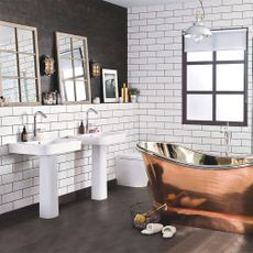 bathroom with white tiled walls and copper bathtub