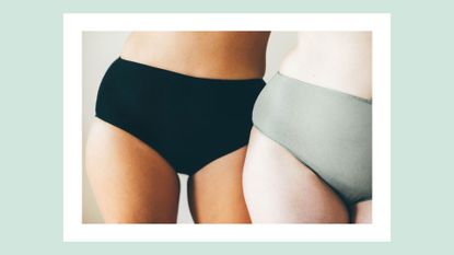 two women in underwear next to one another only the bottom halves of their bodies are visible
