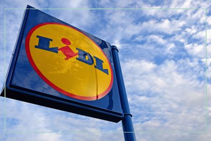 A close up of the Lidl logo sign, with a cloudy sky in the background/ taken on October 29, 2014 in Glasgow,Scotland.