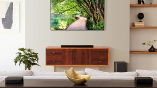 JBL Bar 1300 pres imagae showing sound bar in lifestyle setting with TV