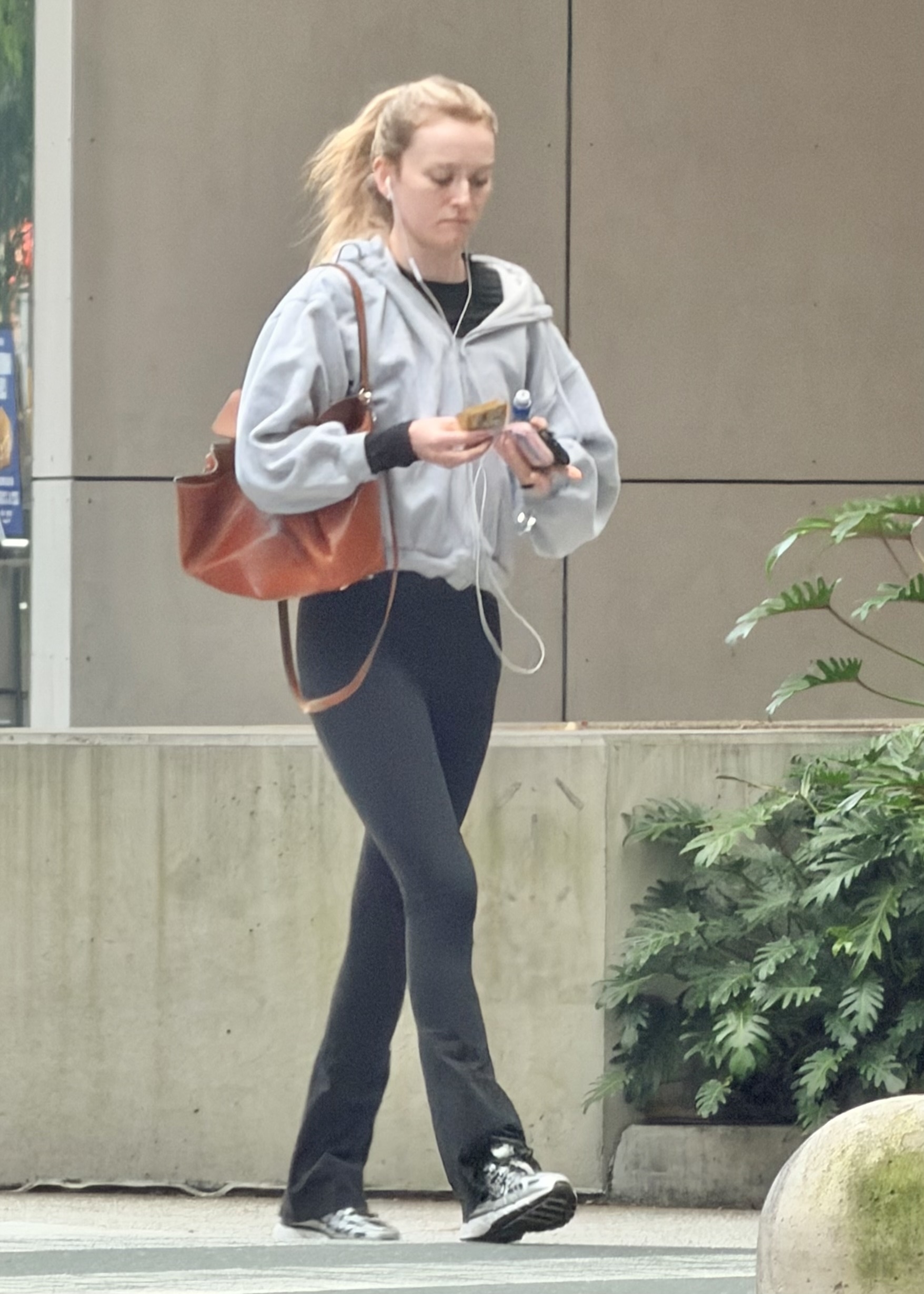 Sarah Pidgeon wearing flared leggings and Nike sneakers in Brisbane