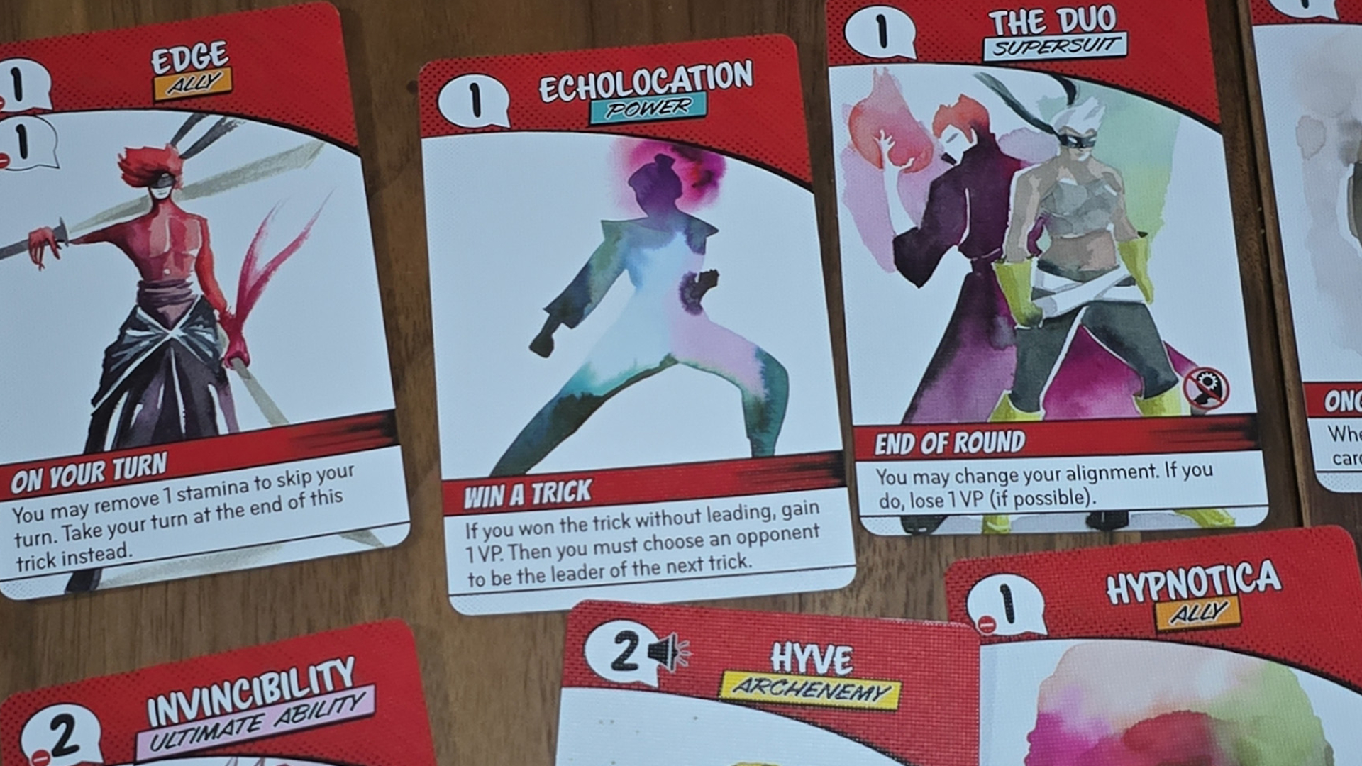 Origin Story cards laid out on a wooden surface