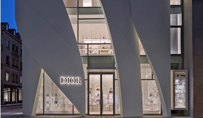 Dior Geneva by Christian de Portzamparc entrance view at dusk lit from within