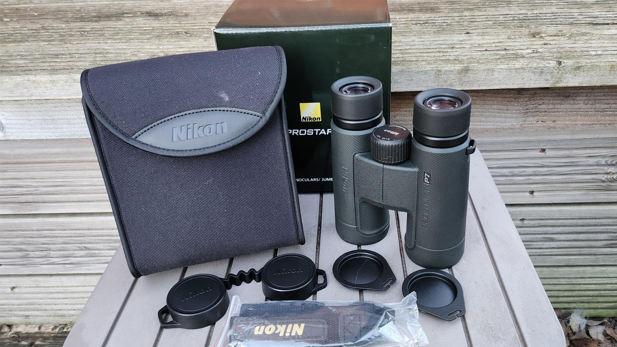 A photo of the Nikon Prostaff P7 8x42 and included accessories