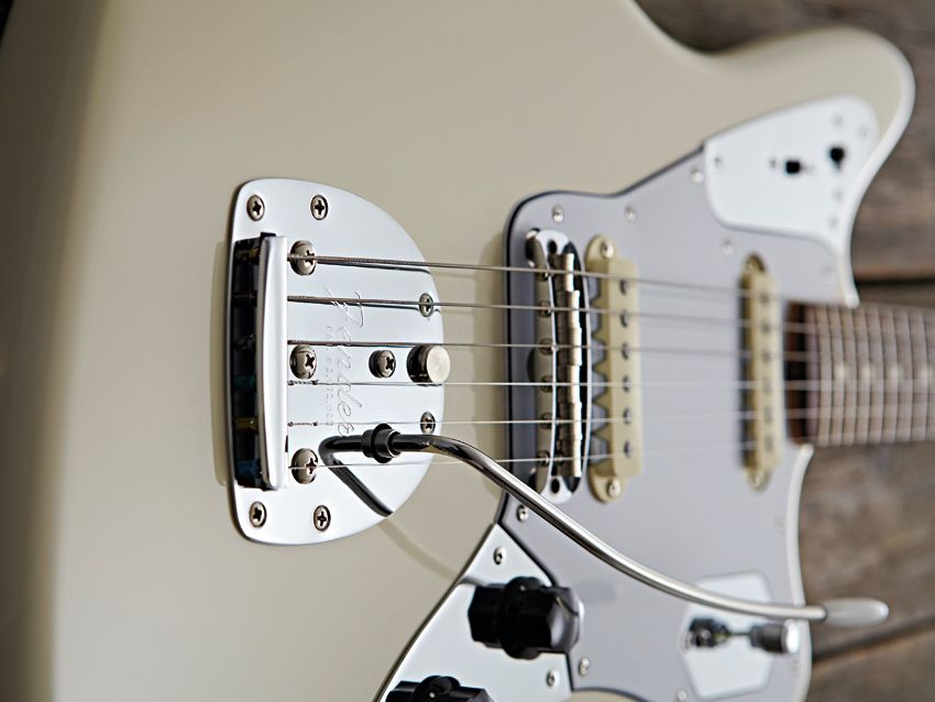 The Johny Marr model's new bridge assembly uses Mustang saddles and nylon 'locks' for screw stability.