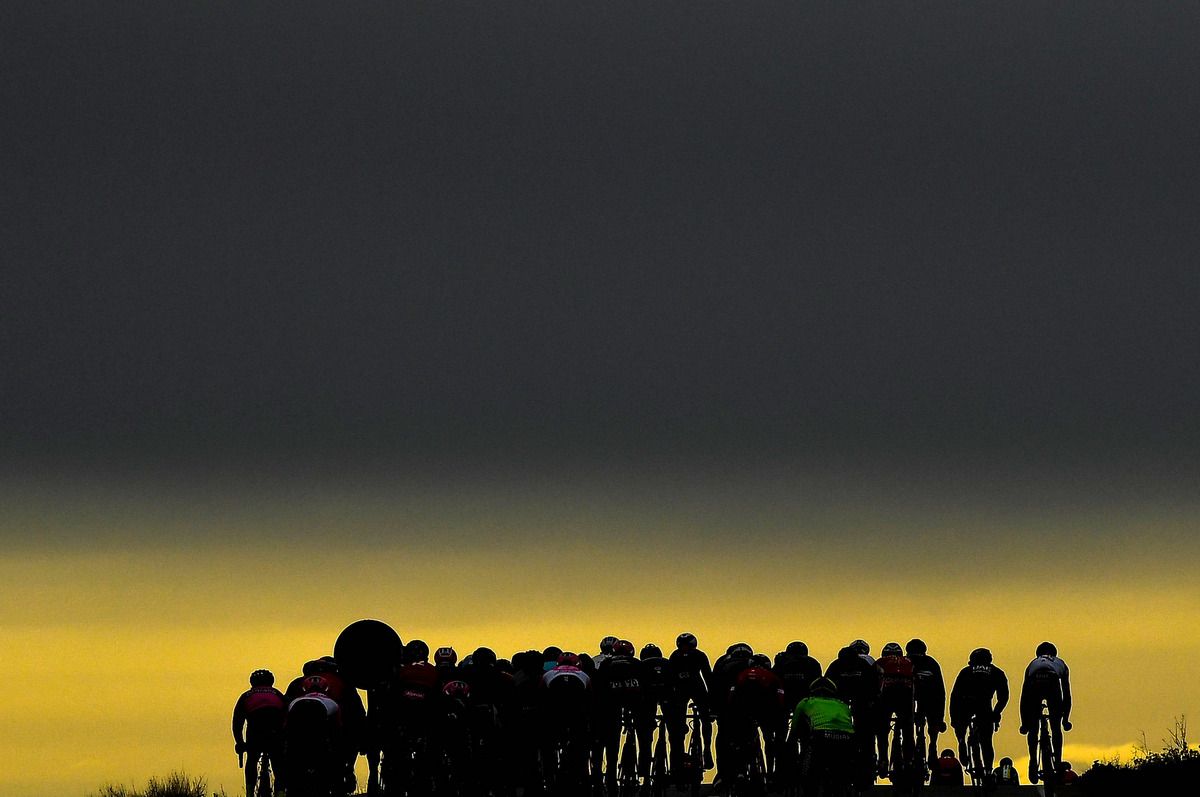 A silhouette of the peloton