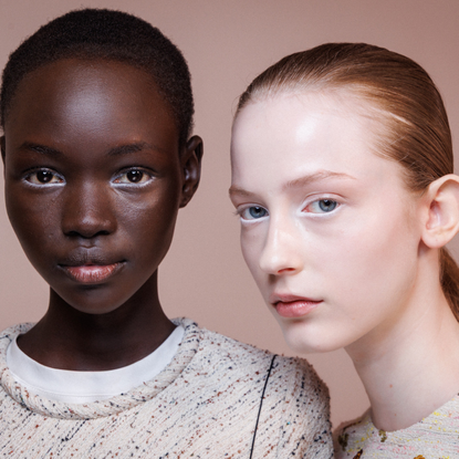 Two models wearing white eyeliner