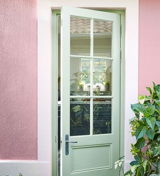 How to paint an exterior wall with pink wall and green door