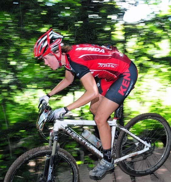 Heather Holmes (Kenda-Tomac-Titus) crosses some wooden planks.