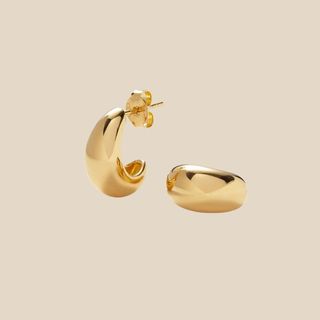 flat lay image of gold hoops