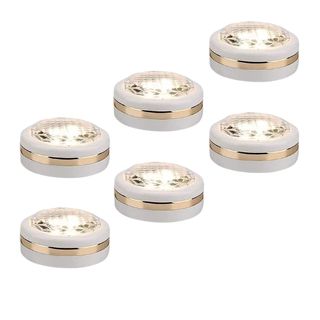 Six puck lights on white background