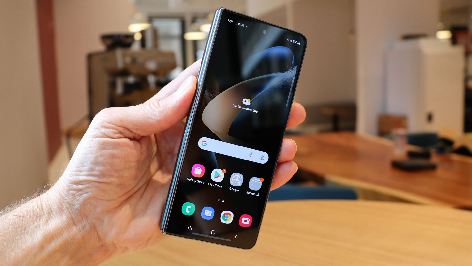 The Samsung Galaxy Z Fold 4 folded, in someone's hand