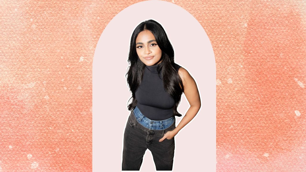 Nikita Karizma in two pairs of jeans and a black top on a peach and pink background