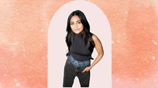 Nikita Karizma in two pairs of jeans and a black top on a peach and pink background