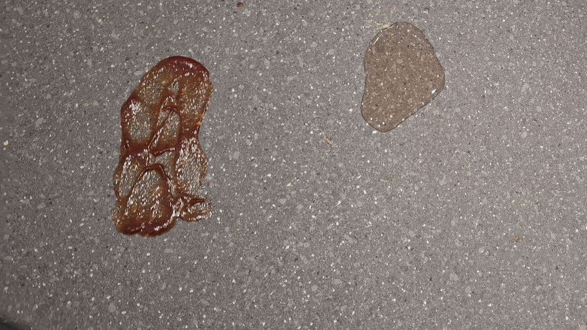 Ketchup and juice on the floor before mopping tests on hard floor with iRobot Roomba Combo Essential