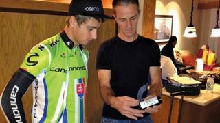 A younger Sagan works with Capron to measure post-exercise hydration