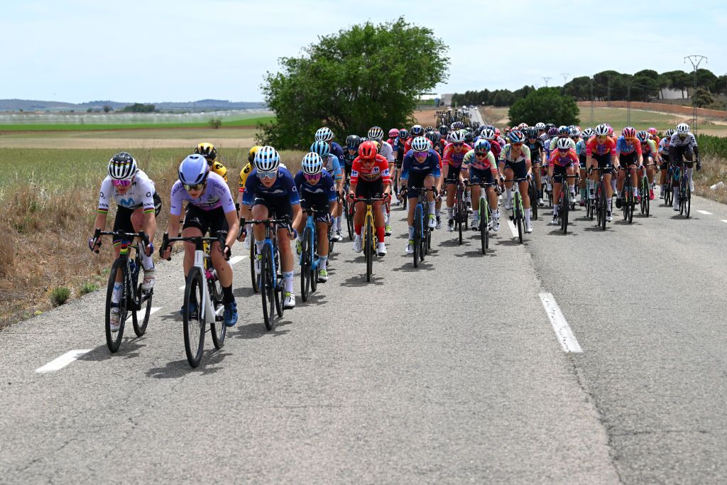 LA RODA SPAIN MAY 03 Floortje Mackaij of The Netherlands Paula Patio of Colombia and Movistar Team and Marianne Vos of The Netherlands and Team JumboVisma Red Leader Jersey lead the peloton during the 9th La Vuelta Femenina 2023 Stage 3 a 1578km stage from Elche de la Sierra to La Roda UCIWWT on May 03 2023 in La Roda Spain Photo by Dario BelingheriGetty Images