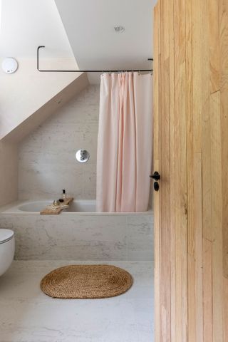 bathroom with sloping ceilings