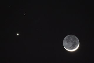 In this cropped photo taken by Imelda Joson and Edwin Aguirre on February 20, Venus appears as a brilliant "star" on the left, with dimmer Mars above it. Note the nice "earthshine" illuminating the moon's dark side. Although the trio looked close together as viewed along our line of sight, the celestial bodies were actually situated far apart in space. Venus was 134 million miles from Earth at the time, while Mars was 203 million miles away. The moon was much, much closer — a "mere" 225,000 miles away. Imelda and Edwin used a Canon EOS 5D Mark II DSLR camera at the prime focus of a Takahashi FC-60 refractor to capture this winter scene.