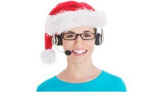 A woman with a santa hat on and a headset