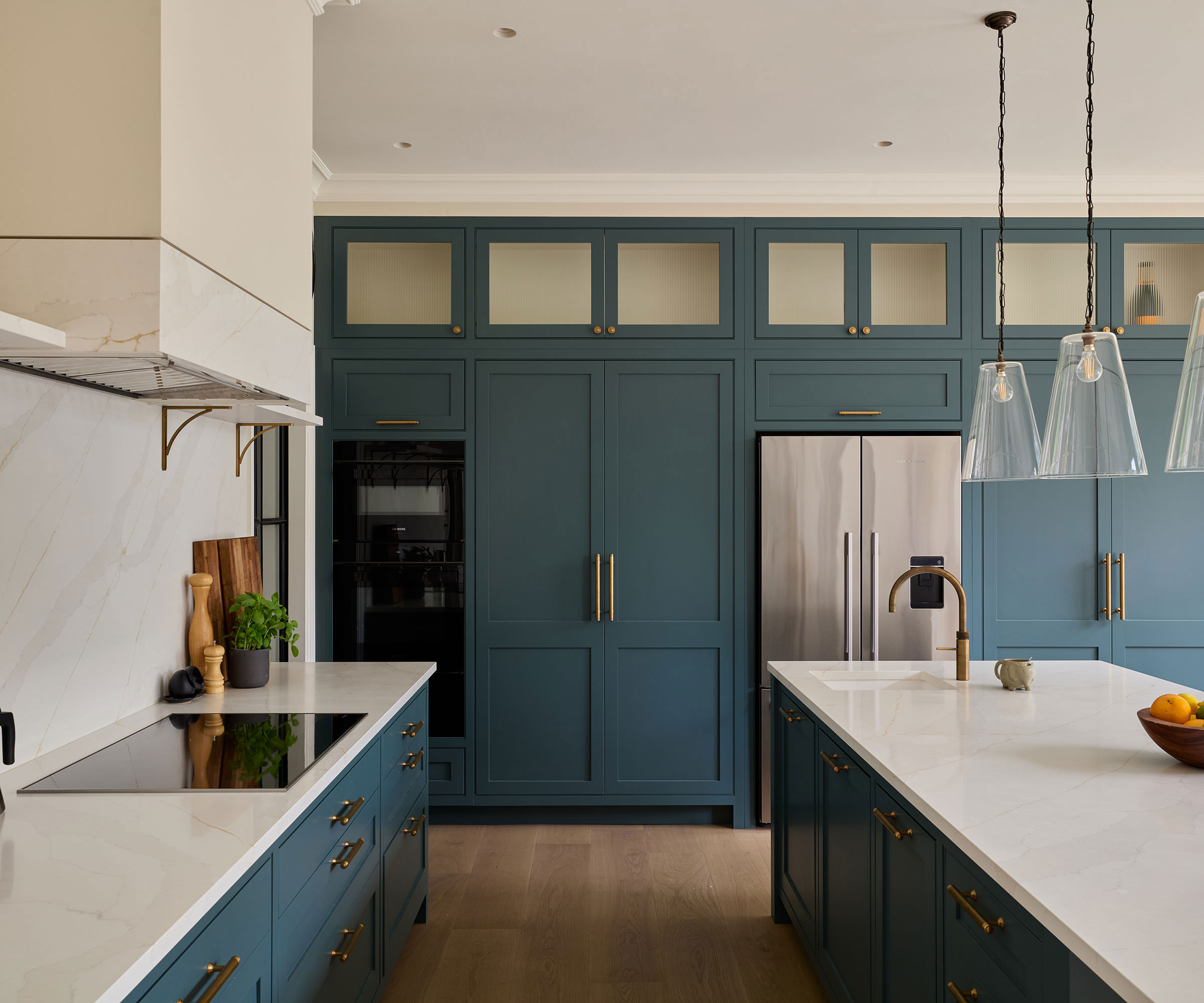 blue Shaker kitchen with white worktops and full height kitchen units