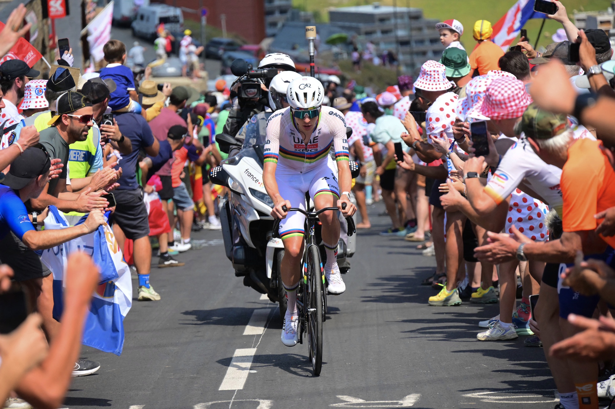 UAE Team Emirates - XRG rider Tadej Pogacar races up the ascent of the Col du Tourmalet during the 6th stage of the 113th edition of the Tour de France, with the crowd leaning in cheering (Photo by Bernard PAPON / POOL / AFP)