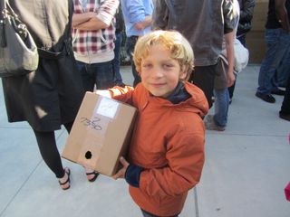 Six-year-old Cal Smolenski holds a homemade eclipse viewer at San Francisco's Crissy field on May 20, 2012.