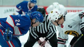 Shane and Ilya facing off against each other on the ice in Heated Rivalry.