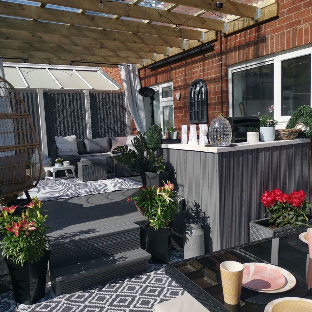 Couple transform decking area using shower curtains and bargain buys