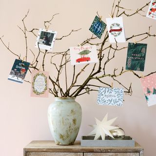 Branches in vase with cards