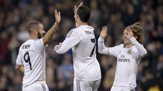 Cristiano Ronaldo, Karim Benzema and Luka Modric celebrate a goal for Real Madrid against Real Betis in January 2014.