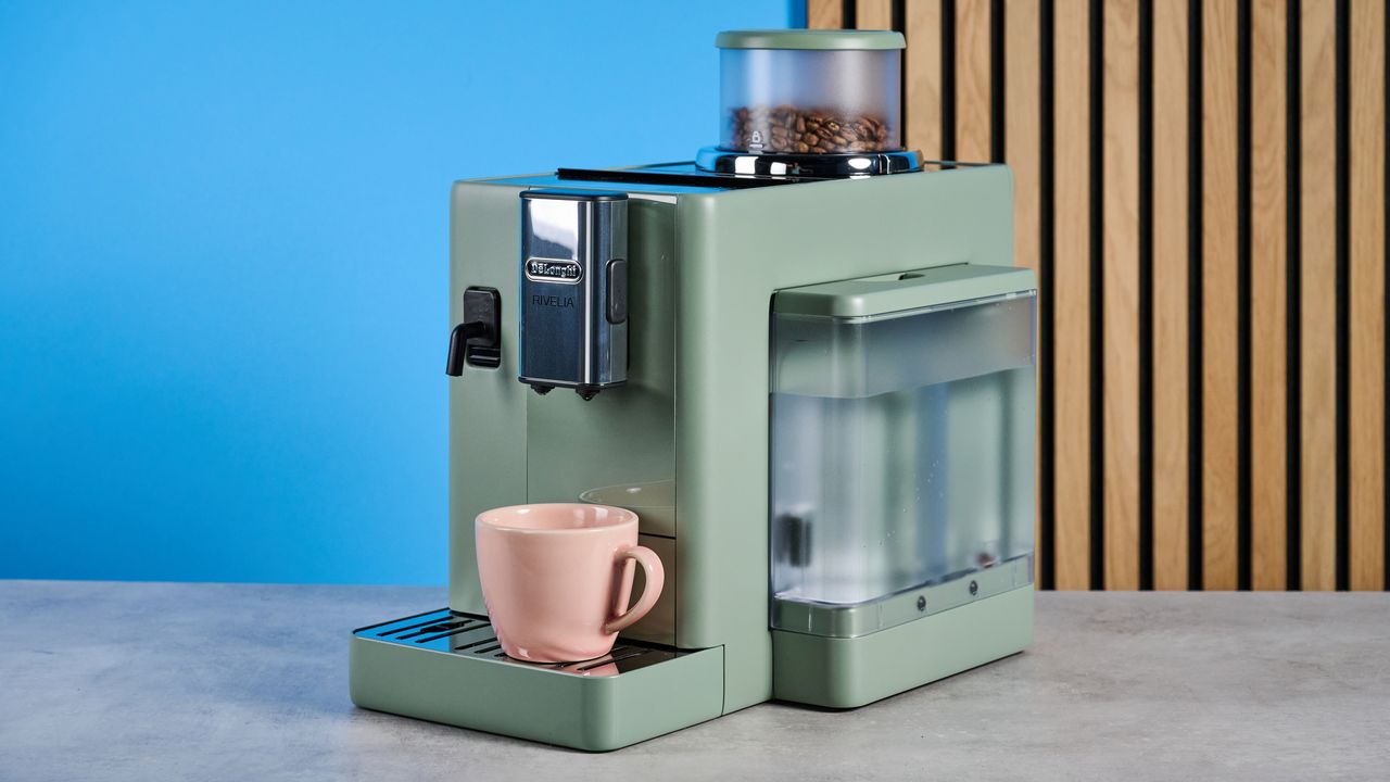 the de'longhi rivelia automatic superautomatic coffee machine in sage green with a bright LED screen, two interchangeable bean hoppers, an automatic milk frother, and a huge range of coffee recipes