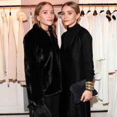 Mary-Kate Olsen and her twin sister Ashley Olsen pose during Mary-Kate Olsen and Ashley Olsen present their collection 'The Row' at Marion Heinrich on November 20, 2014 in Munich, Germany. 