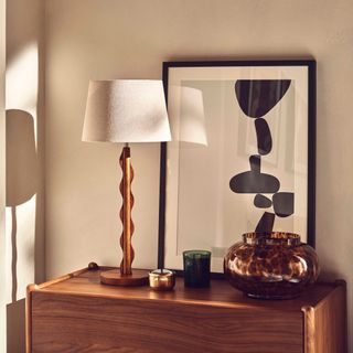 John Lewis Wiggle Table Lamp on wooden dresser in bedroom
