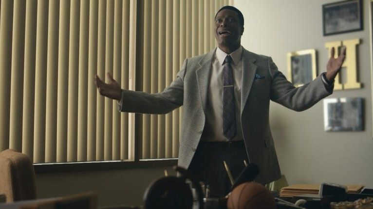 Chris Tucker with his arms up in AIR
