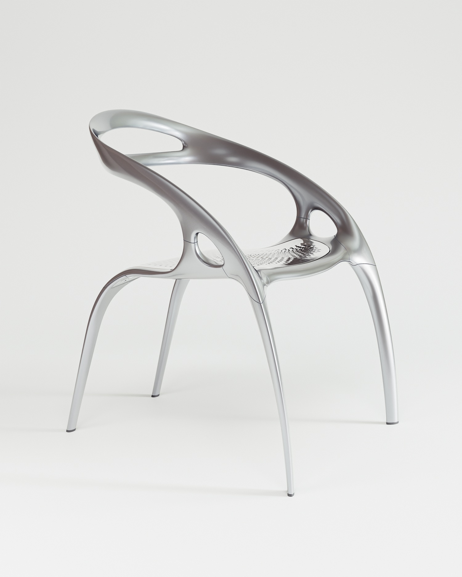 silver armchair with swooping form
