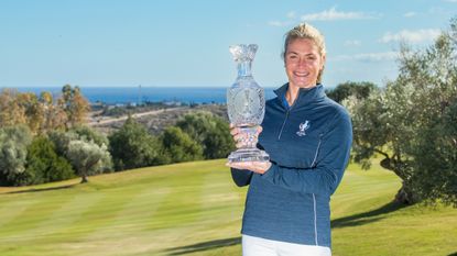 Suzann Pettersen holds the Solheim Cup trophy