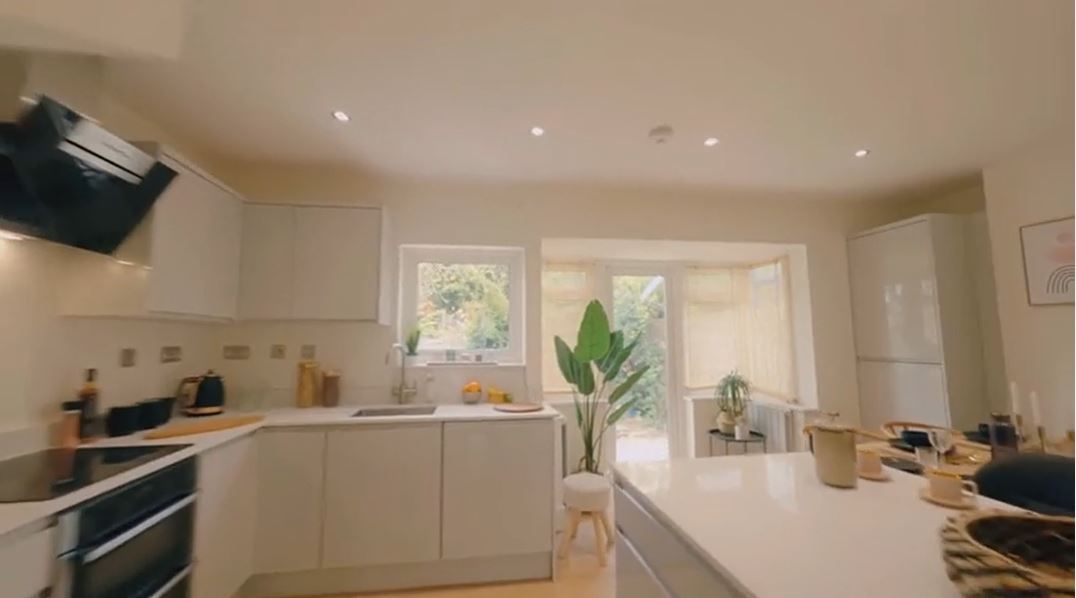 Newly renovated kitchen with cream units and white quartz worktop