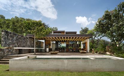 Toucan House by Taller Hector Barrosa forms a cascading terrace of modern style pavilions in the cosmopolitan hillside of Valle de Bravo
