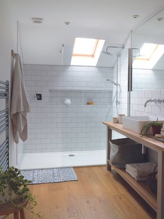 Modern bathroom with large walk-in shower and white wall tiles